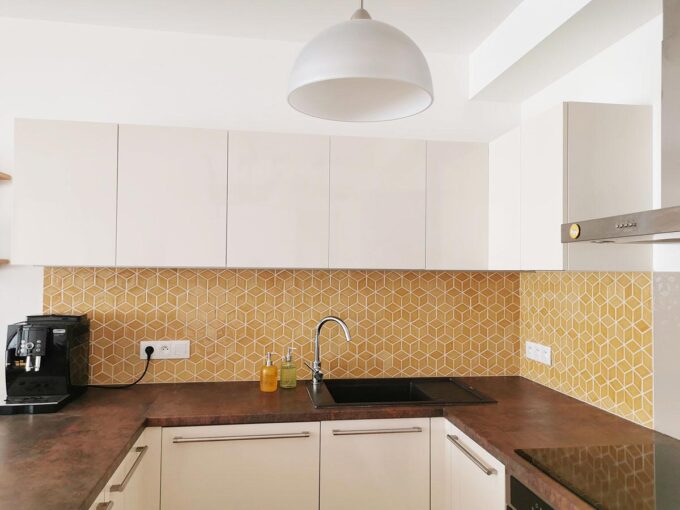 Honey Diamond Tiles as Kitchen Backsplash with White Cabinets